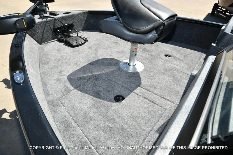 Slide: The Image of 2025 Tracker Pro Guide V-175 Combo boat interior with seating and carpeted deck. - 36