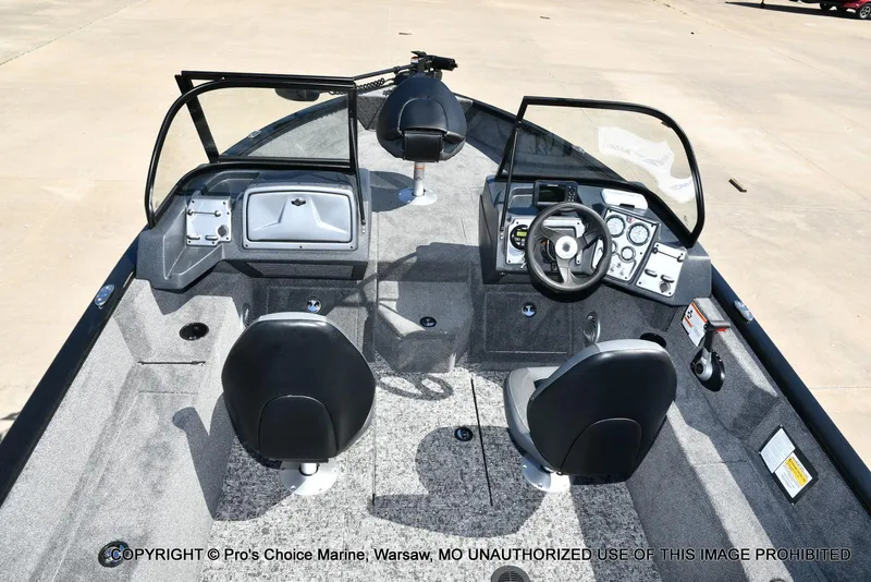 Slide: The Image of 2025 Tracker Pro Guide V-175 Combo boat interior with dual seats and control panel. - 37