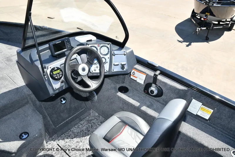 Slide: The Image of 2025 Tracker Pro Guide V-175 Combo boat interior with steering wheel and controls. - 38