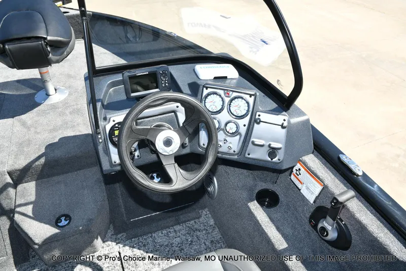 Slide: The Image of 2025 Tracker Pro Guide V-175 Combo boat dashboard with steering wheel and gauges. - 39