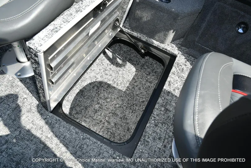 Slide: The Image of 2025 Tracker Pro Guide V-175 Combo boat interior storage compartment with gray carpet and seating. - 44