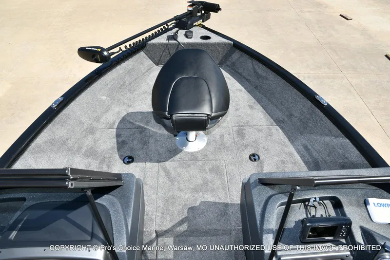 Slide: The Image of 2025 Tracker Pro Guide V-175 Combo boat interior with seating and control panel. - 48