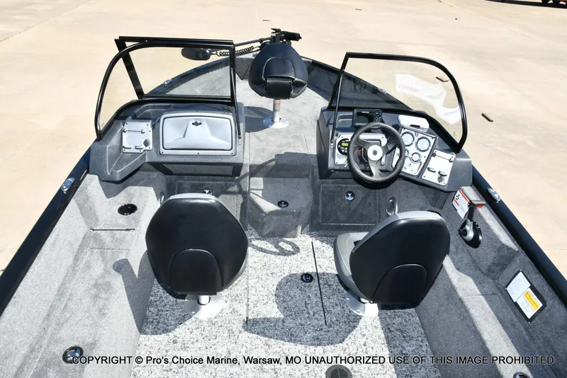 Slide: The Image of 2025 Tracker Pro Guide V-175 Combo boat interior with dual seats and control panel. - 6