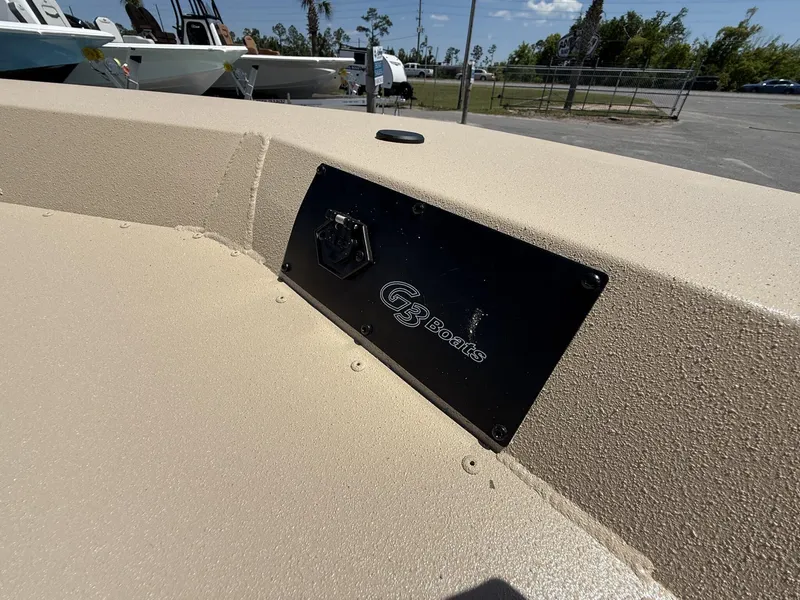 Slide: The Image of G3 Bay 20 boat, 2025 model, with logo plate in a sunny outdoor setting. - 10