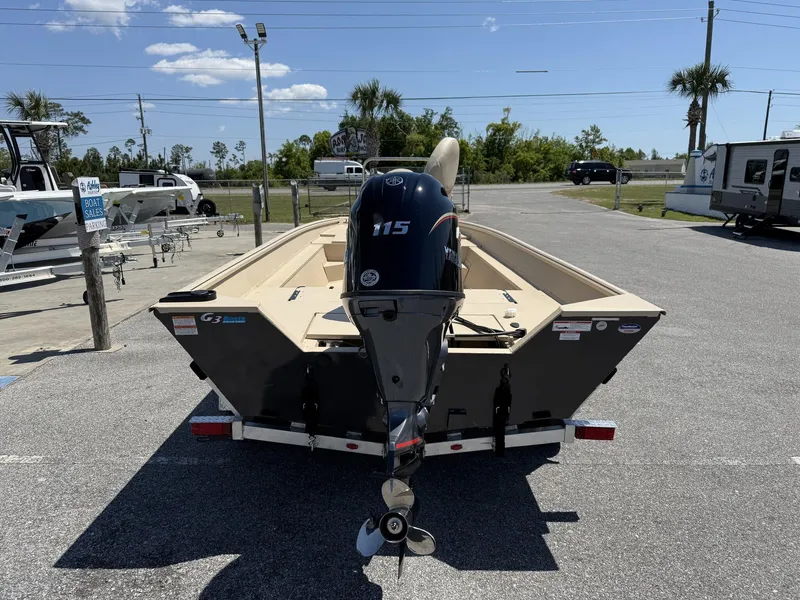 Slide: The Image of 2025 G3 Bay 20 boat with 115 horsepower engine on a trailer in a parking lot. - 7