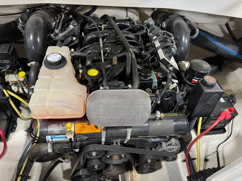 Slide: The Image of Engine of 2004 Chaparral 260 SSi boat, showcasing intricate components and wiring. - 14