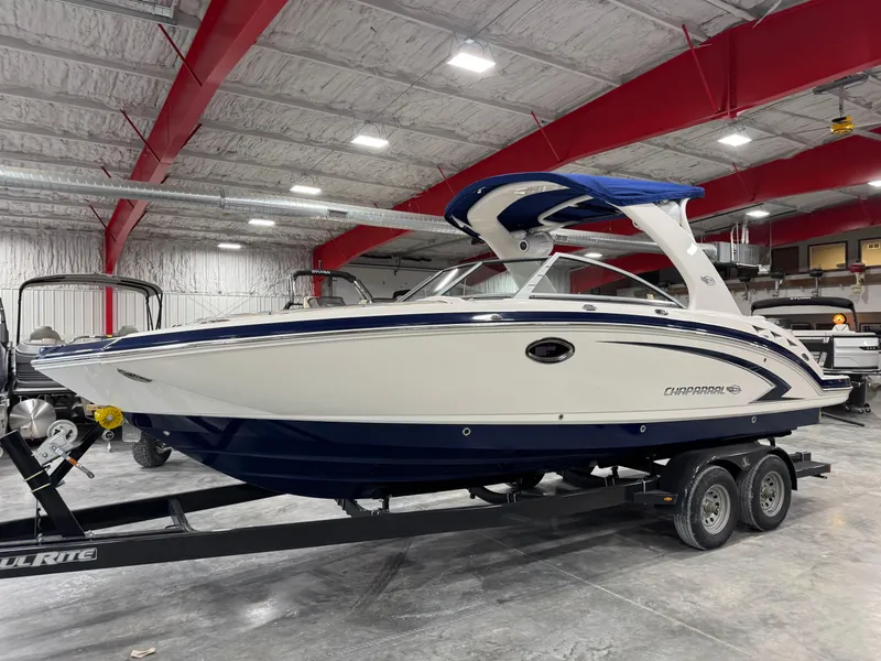 Slide: The Image of 2010 Chaparral 264 Sunesta boat on trailer in indoor storage facility. - 1