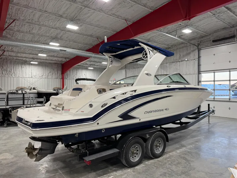 Slide: The Image of 2010 Chaparral 264 Sunesta boat on trailer in indoor storage facility. - 3
