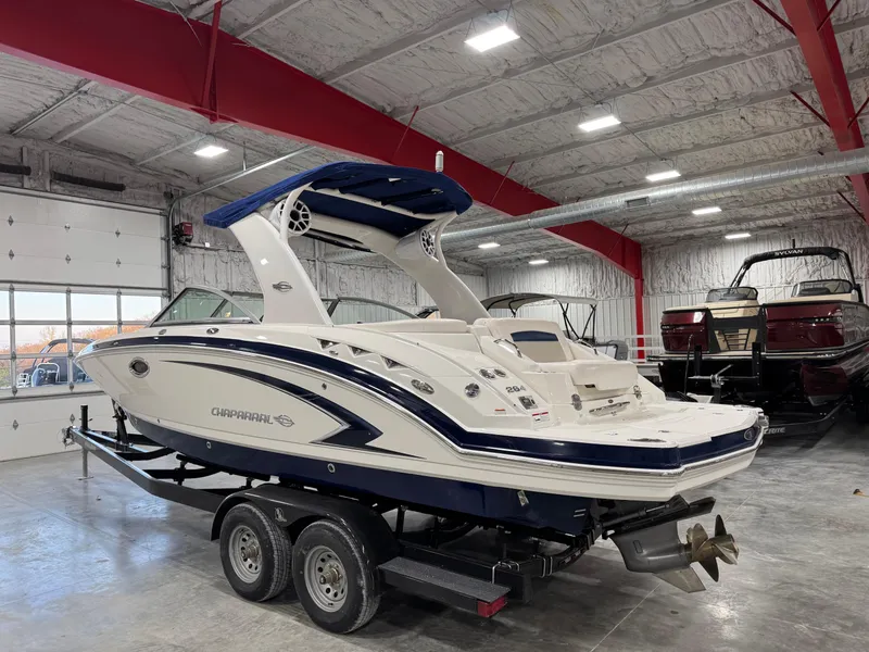 Slide: The Image of 2010 Chaparral 264 Sunesta boat on trailer in indoor storage facility. - 4
