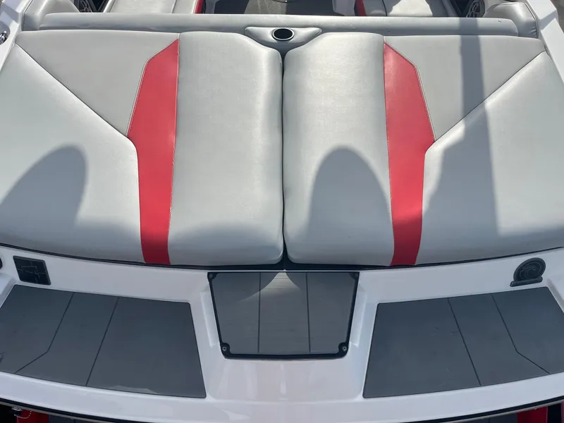 Slide: The Image of 2021 Axis A22 boat with gray and red cushioned seating. - 16