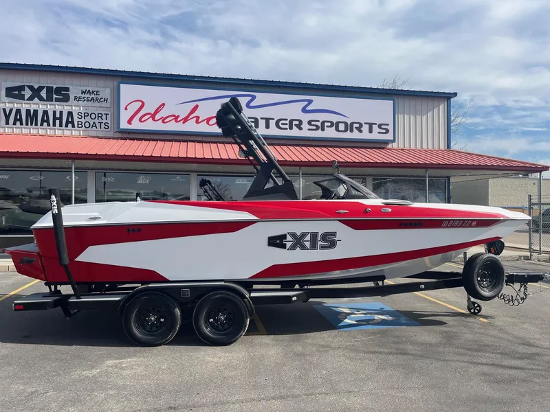 Slide: The Image of 2021 Axis A22 boat in red and white at Idaho Water Sports dealership. - 3