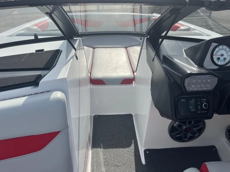 Slide: The Image of 2021 Axis A22 boat interior with modern dashboard and seating. - 30