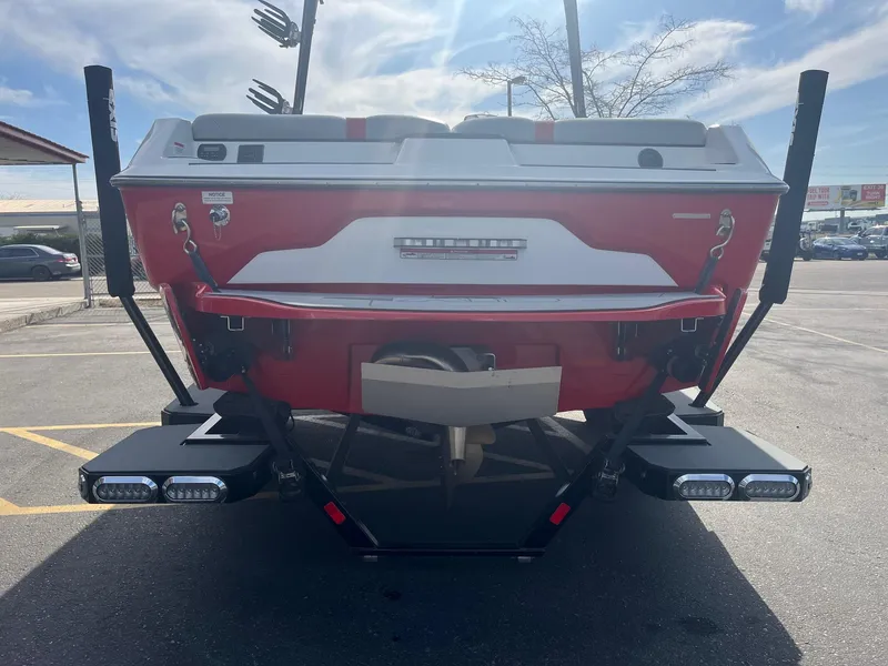 Slide: The Image of Rear view of a 2021 Axis A22 boat in a parking lot. - 5