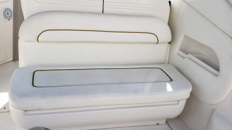 Slide: The Image of White leather seating on a 2002 Sea Ray 300 Sundancer boat. - 11