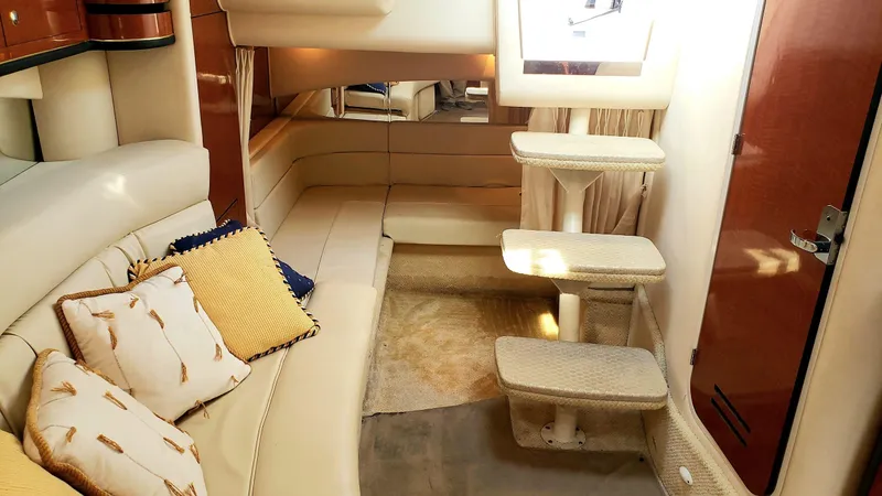Slide: The Image of Luxurious interior of 2002 Sea Ray 300 Sundancer yacht with plush seating and elegant decor. - 21