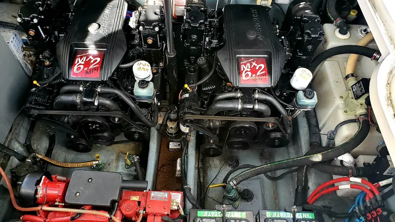 Slide: The Image of Twin MerCruiser 6.2 engines in a 2002 Sea Ray 300 Sundancer boat. - 34