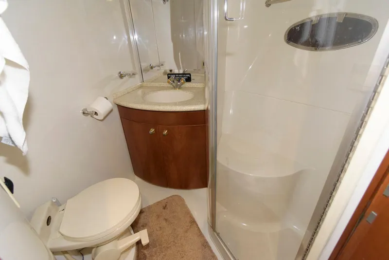 Slide: The Image of Bathroom interior of 1999 Carver 450 Voyager Pilothouse with shower and vanity. - 19