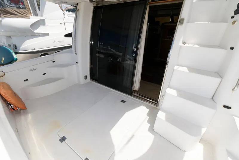 Slide: The Image of 1999 Carver 450 Voyager Pilothouse yacht interior with stairs and sliding glass door. - 3