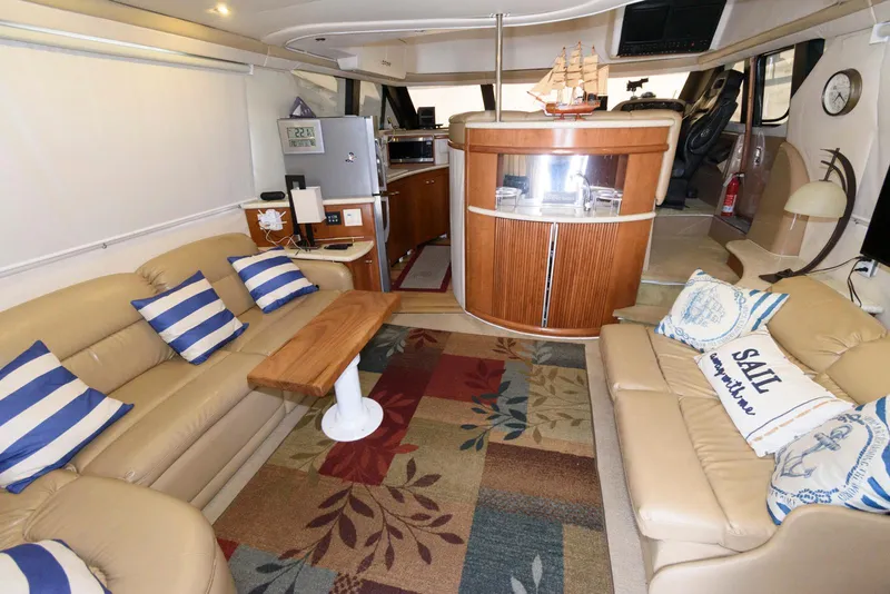 Slide: The Image of Luxurious interior of 1999 Carver 450 Voyager Pilothouse with cozy seating and nautical decor. - 9
