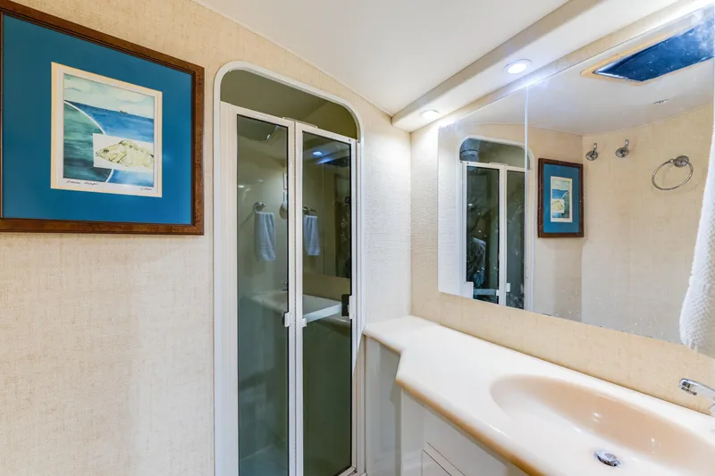 Slide: The Image of Bathroom interior of 1999 Viking 47 Convertible yacht with shower and sink. - 25