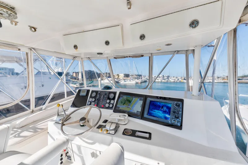 Slide: The Image of Interior view of 1999 Viking 47 Convertible yacht cockpit with navigation equipment. - 6