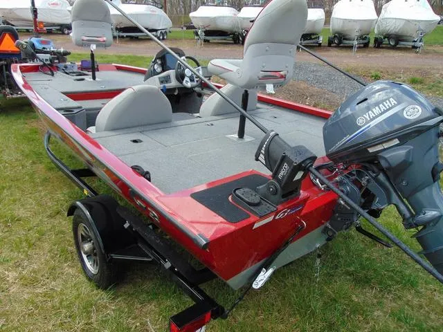 Slide: The Image of 2018 G3 Sportsman 17 fishing boat with Yamaha motor, parked on grass. - 4