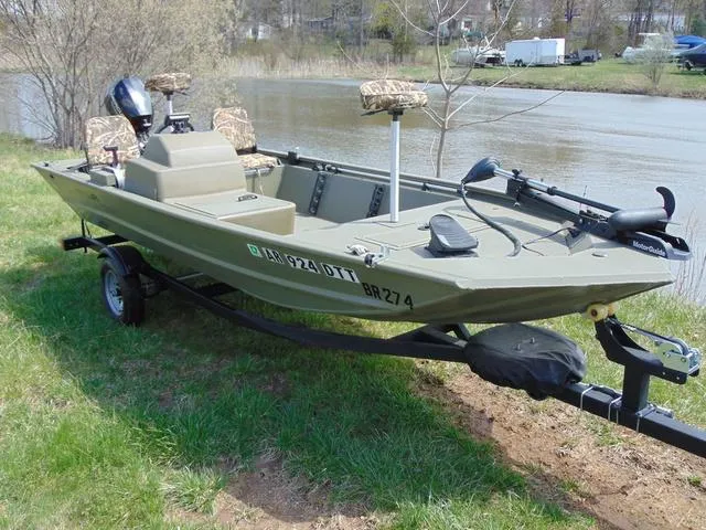 Slide: The Image of 2020 Tracker GRIZZLY® 1648 SC boat on trailer by a riverbank. - 3