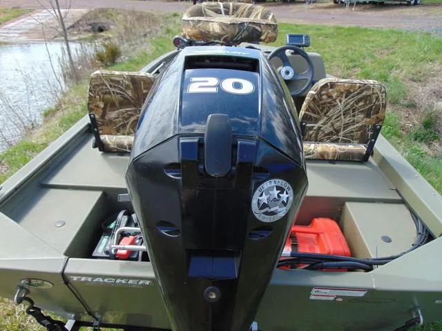 Slide: The Image of 2020 Tracker GRIZZLY® 1648 SC boat with camo seats and 20 HP outboard motor. - 5