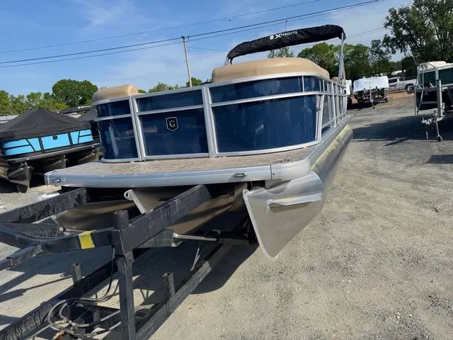 Slide: The Image of 2025 Godfrey Sweetwater 2286 SBX Tritoon with 150 Yamaha engine on trailer. - 10