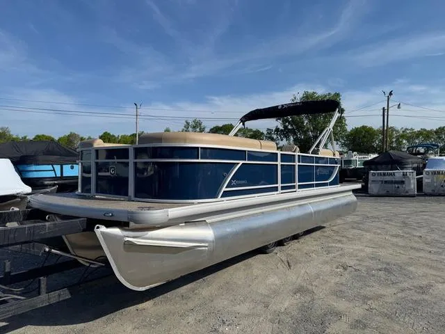 Slide: The Image of 2025 Godfrey Sweetwater 2286 SBX Tritoon with 150 Yamaha engine on trailer. - 2