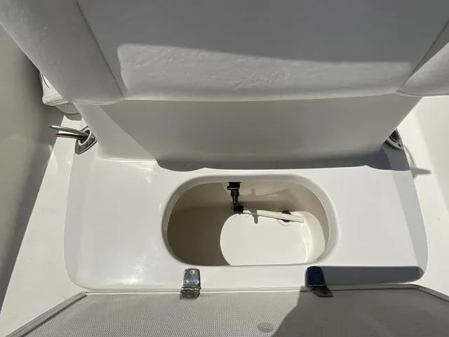 Slide: The Image of White boat seat storage compartment on a 2007 Blazer 2220 Pro. - 14