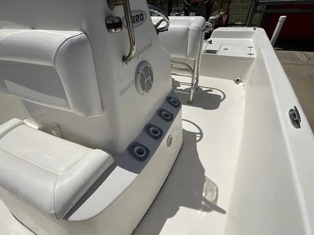 Slide: The Image of 2007 Blazer 2220 Pro boat interior with white seating and control panel. - 15