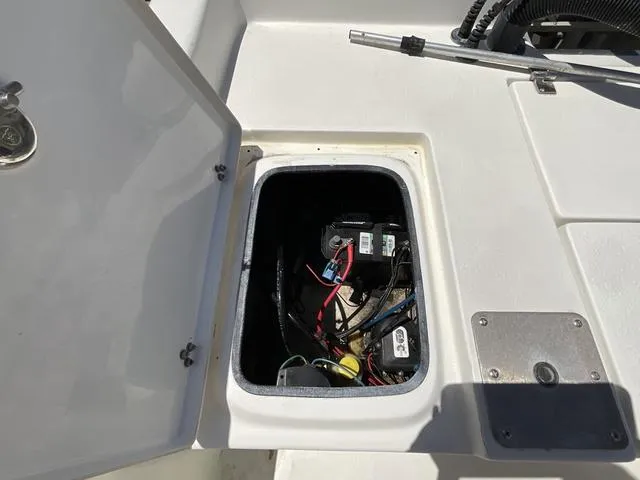 Slide: The Image of Open hatch on 2007 Blazer 2220 Pro boat showing internal wiring and components. - 20