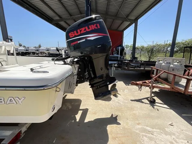 Slide: The Image of Boat with Suzuki outboard motor under a metal canopy, Blazer 2220 Pro, 2007 model. - 4