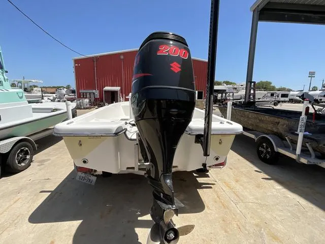Slide: The Image of 2007 Blazer 2220 Pro boat with Suzuki 200 outboard motor, parked outdoors. - 5