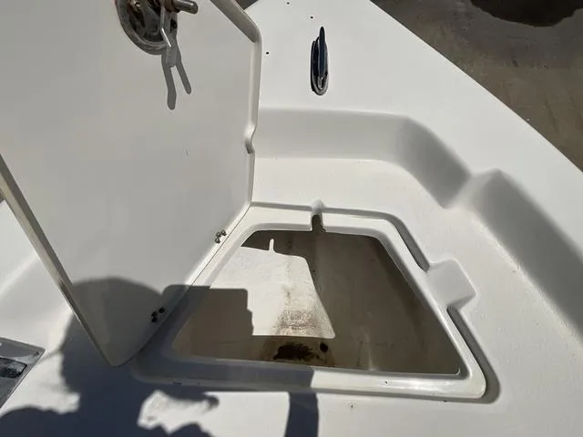 Slide: The Image of Open storage compartment on a 2007 Blazer 2220 Pro boat deck. - 8