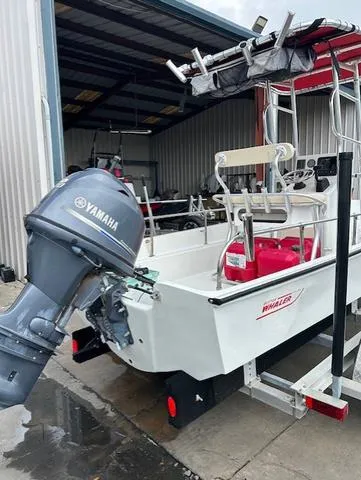 Slide: The Image of 1984 Boston Whaler 17 Montauk with Yamaha outboard motor in a storage facility. - 7