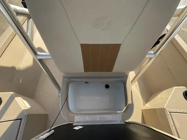 Slide: The Image of 2023 G3 BAY20GX boat interior with storage compartment and seating. - 12