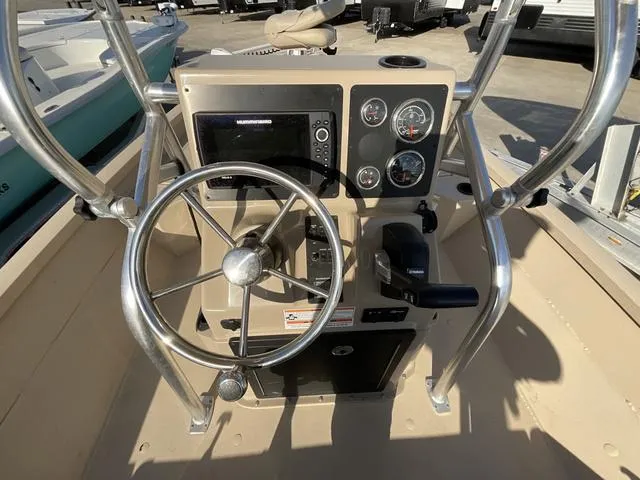 Slide: The Image of 2023 G3 BAY20GX boat console with steering wheel and navigation controls. - 13