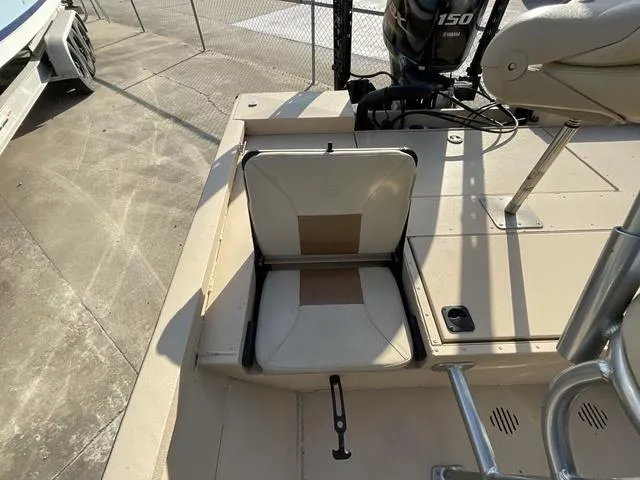 Slide: The Image of 2023 G3 BAY20GX boat seat and motor, outdoor setting, beige deck. - 17