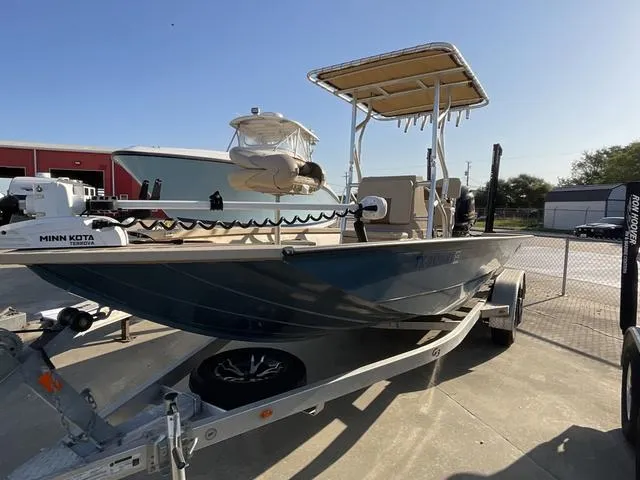 Slide: The Image of 2023 G3 BAY20GX boat on trailer with Minn Kota motor, parked outdoors. - 3