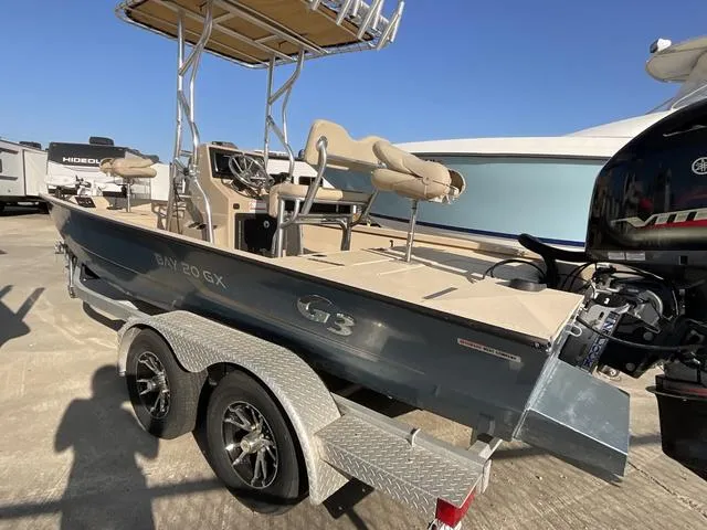 Slide: The Image of 2023 G3 BAY20GX boat on trailer, featuring elevated seating and modern design. - 4