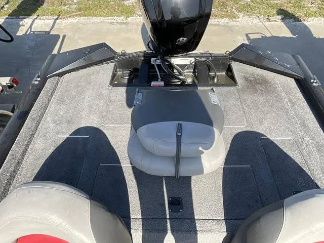 Slide: The Image of 2015 Tracker Pro 175 boat interior with seating and motor, viewed from above. - 12