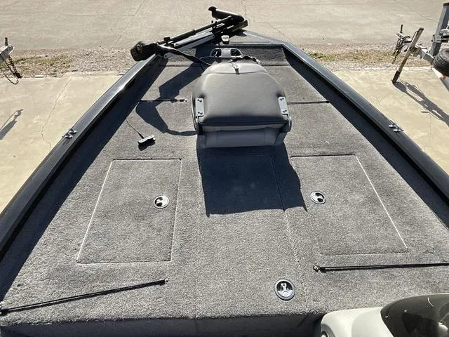 Slide: The Image of 2015 Tracker Pro 175 boat deck with seating and storage compartments. - 7