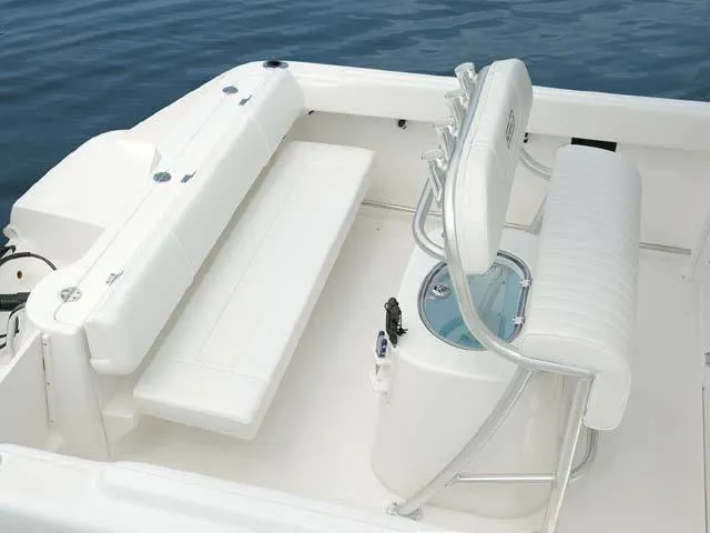 Slide: The Image of 2009 Robalo Center Console R220 boat interior with white seating and console. - 3