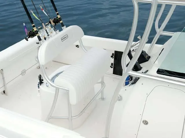 Slide: The Image of 2009 Robalo Center Console R220 boat interior with fishing rods and seating. - 5