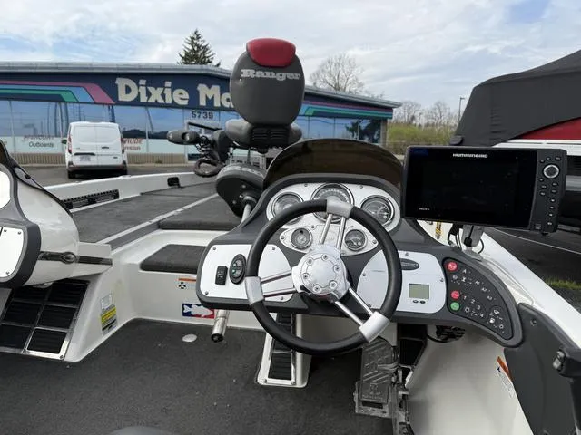 Slide: The Image of 2006 Ranger Z19 boat dashboard with steering wheel and electronic display. - 5