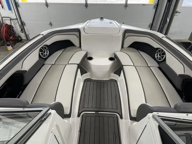 Slide: The Image of 2018 Yamaha Boats 212 Limited S interior with sleek seating and modern design. - 13