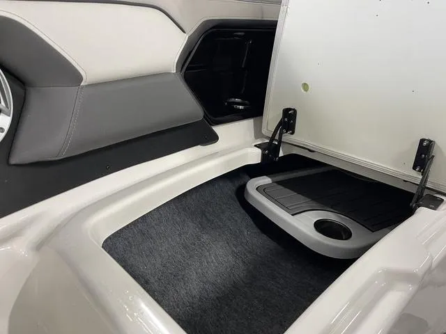 Slide: The Image of Interior storage compartment of 2018 Yamaha Boats 212 Limited S, featuring sleek design and ample space. - 16