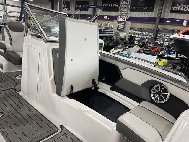 Slide: The Image of 2018 Yamaha Boats 212 Limited S interior with seating and speaker in showroom. - 17